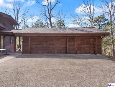 This is a custom Lindal Cedar Home that is designed to blend on Doe Valley Country Club in Kentucky - for sale on GolfHomes.com, golf home, golf lot