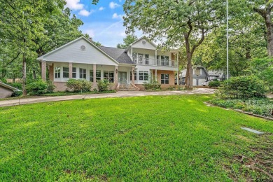 Experience resort-style living in this beautiful 4-bedroom on Hide-A-Way Lake Golf Course in Texas - for sale on GolfHomes.com, golf home, golf lot