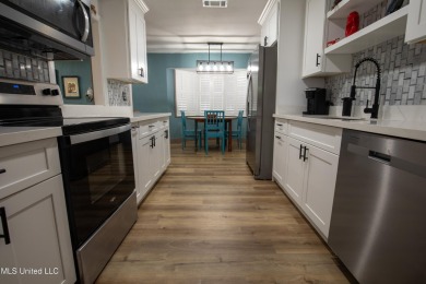 Welcome to this beautifully updated 3-bedroom, 2-bathroom home on Gulf Hills Golf Club in Mississippi - for sale on GolfHomes.com, golf home, golf lot