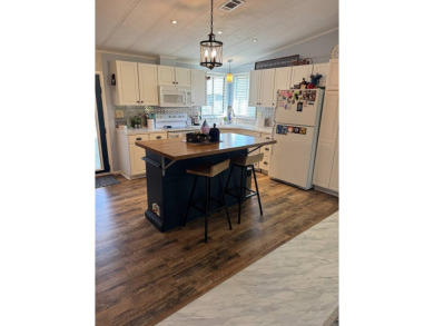 This beautifully maintained 3-bedroom, 2-bath Palm Harbor home on The Meadows At Countrywood in Florida - for sale on GolfHomes.com, golf home, golf lot
