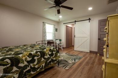Welcome to this beautifully updated 3-bedroom, 2-bathroom home on Gulf Hills Golf Club in Mississippi - for sale on GolfHomes.com, golf home, golf lot