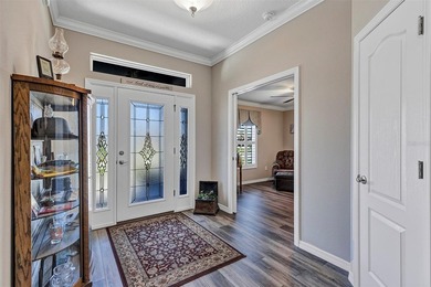 Welcome to a life that feels like vacation every day. Nestled in on Arlington Ridge Golf Club in Florida - for sale on GolfHomes.com, golf home, golf lot