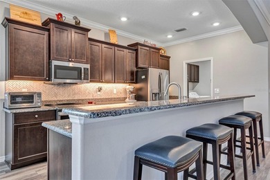 Welcome to a life that feels like vacation every day. Nestled in on Arlington Ridge Golf Club in Florida - for sale on GolfHomes.com, golf home, golf lot