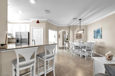 Welcome to this charming villa, formerly a model home, that is on Pelican Preserve Golf Club in Florida - for sale on GolfHomes.com, golf home, golf lot