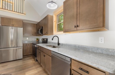 Welcome to *Altitude Adjustment,* a stunning new construction on Alpine Lake Resort in West Virginia - for sale on GolfHomes.com, golf home, golf lot
