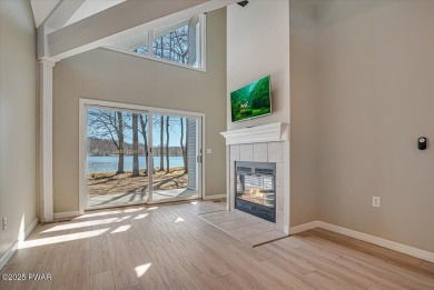 Unbeatable location nestled directly between the tranquil shores on Paupack Hills Golf and Country Club in Pennsylvania - for sale on GolfHomes.com, golf home, golf lot