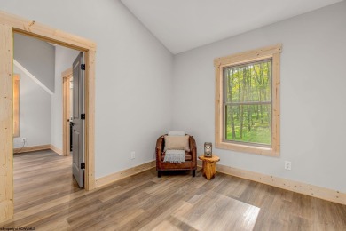 Welcome to *Altitude Adjustment,* a stunning new construction on Alpine Lake Resort in West Virginia - for sale on GolfHomes.com, golf home, golf lot