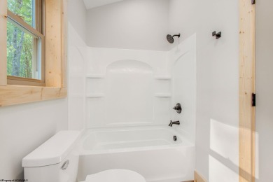 Welcome to *Altitude Adjustment,* a stunning new construction on Alpine Lake Resort in West Virginia - for sale on GolfHomes.com, golf home, golf lot