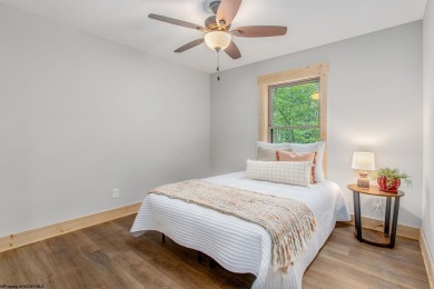 Welcome to *Altitude Adjustment,* a stunning new construction on Alpine Lake Resort in West Virginia - for sale on GolfHomes.com, golf home, golf lot