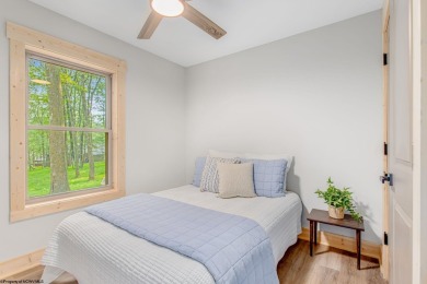 Welcome to *Altitude Adjustment,* a stunning new construction on Alpine Lake Resort in West Virginia - for sale on GolfHomes.com, golf home, golf lot