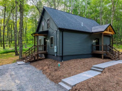 Welcome to *Altitude Adjustment,* a stunning new construction on Alpine Lake Resort in West Virginia - for sale on GolfHomes.com, golf home, golf lot