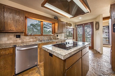 Stunning Mid-Century Mountain Retreat! Nestled among the trees on Mountain Ranch Golf Club in Arkansas - for sale on GolfHomes.com, golf home, golf lot