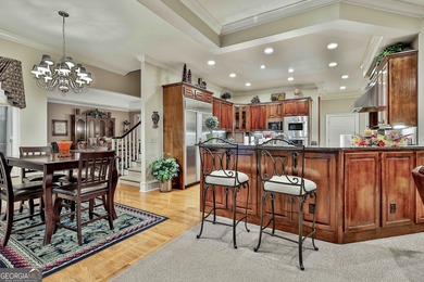 Don't miss this custom built all brick home with a 4 car garage on Whitewater Creek in Georgia - for sale on GolfHomes.com, golf home, golf lot