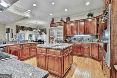Don't miss this custom built all brick home with a 4 car garage on Whitewater Creek in Georgia - for sale on GolfHomes.com, golf home, golf lot