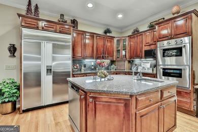 Don't miss this custom built all brick home with a 4 car garage on Whitewater Creek in Georgia - for sale on GolfHomes.com, golf home, golf lot