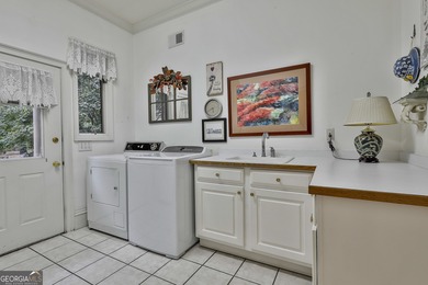 Don't miss this custom built all brick home with a 4 car garage on Whitewater Creek in Georgia - for sale on GolfHomes.com, golf home, golf lot