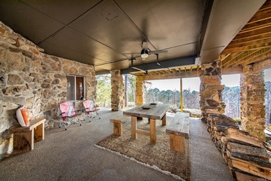 Stunning Mid-Century Mountain Retreat! Nestled among the trees on Mountain Ranch Golf Club in Arkansas - for sale on GolfHomes.com, golf home, golf lot