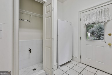 Don't miss this custom built all brick home with a 4 car garage on Whitewater Creek in Georgia - for sale on GolfHomes.com, golf home, golf lot
