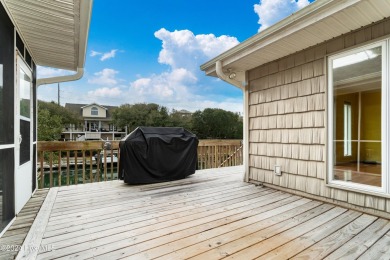 Tucked away on a quiet, canal front cul-de-sac is the home on The Country Club of the Crystal Coast in North Carolina - for sale on GolfHomes.com, golf home, golf lot