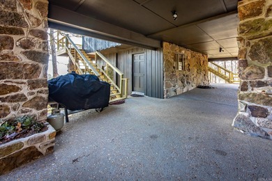 Stunning Mid-Century Mountain Retreat! Nestled among the trees on Mountain Ranch Golf Club in Arkansas - for sale on GolfHomes.com, golf home, golf lot