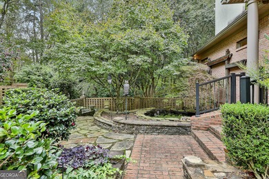 Don't miss this custom built all brick home with a 4 car garage on Whitewater Creek in Georgia - for sale on GolfHomes.com, golf home, golf lot