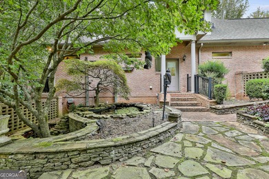 Don't miss this custom built all brick home with a 4 car garage on Whitewater Creek in Georgia - for sale on GolfHomes.com, golf home, golf lot