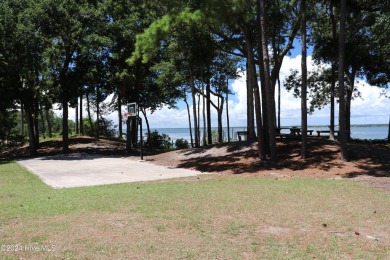 Tucked away on a quiet, canal front cul-de-sac is the home on The Country Club of the Crystal Coast in North Carolina - for sale on GolfHomes.com, golf home, golf lot