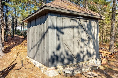 Stunning Mid-Century Mountain Retreat! Nestled among the trees on Mountain Ranch Golf Club in Arkansas - for sale on GolfHomes.com, golf home, golf lot