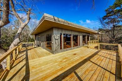 Stunning Mid-Century Mountain Retreat! Nestled among the trees on Mountain Ranch Golf Club in Arkansas - for sale on GolfHomes.com, golf home, golf lot