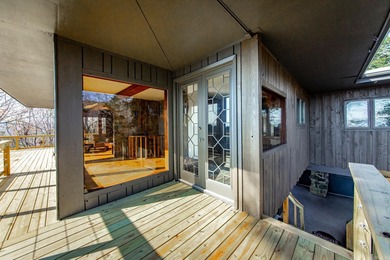 Stunning Mid-Century Mountain Retreat! Nestled among the trees on Mountain Ranch Golf Club in Arkansas - for sale on GolfHomes.com, golf home, golf lot