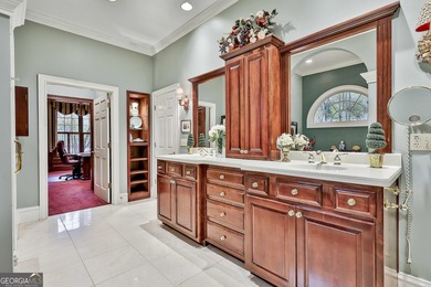 Don't miss this custom built all brick home with a 4 car garage on Whitewater Creek in Georgia - for sale on GolfHomes.com, golf home, golf lot