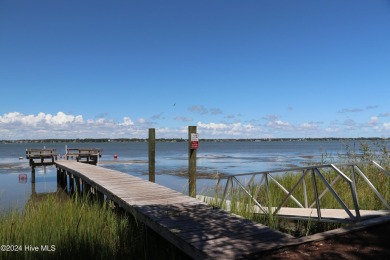 Tucked away on a quiet, canal front cul-de-sac is the home on The Country Club of the Crystal Coast in North Carolina - for sale on GolfHomes.com, golf home, golf lot