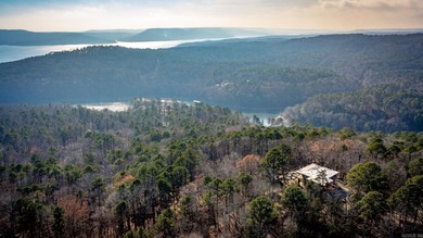 Stunning Mid-Century Mountain Retreat! Nestled among the trees on Mountain Ranch Golf Club in Arkansas - for sale on GolfHomes.com, golf home, golf lot