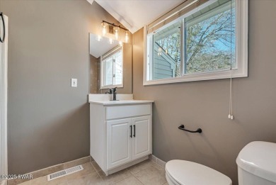 Unbeatable location nestled directly between the tranquil shores on Paupack Hills Golf and Country Club in Pennsylvania - for sale on GolfHomes.com, golf home, golf lot