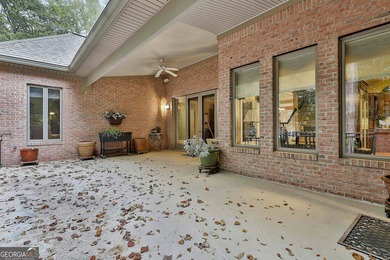 Don't miss this custom built all brick home with a 4 car garage on Whitewater Creek in Georgia - for sale on GolfHomes.com, golf home, golf lot