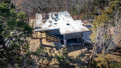 Stunning Mid-Century Mountain Retreat! Nestled among the trees on Mountain Ranch Golf Club in Arkansas - for sale on GolfHomes.com, golf home, golf lot