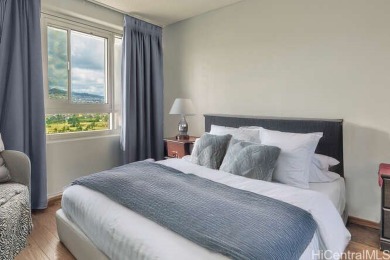 Enjoy breathtaking views from this corner end unit, overlooking on Ala Wai Golf Course in Hawaii - for sale on GolfHomes.com, golf home, golf lot