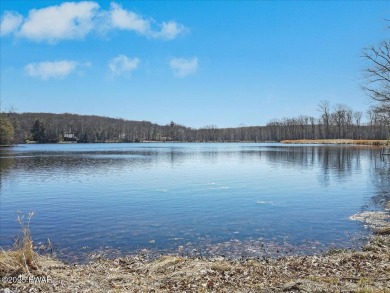 Unbeatable location nestled directly between the tranquil shores on Paupack Hills Golf and Country Club in Pennsylvania - for sale on GolfHomes.com, golf home, golf lot