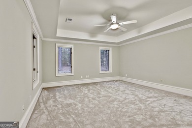 Don't miss this custom built all brick home with a 4 car garage on Whitewater Creek in Georgia - for sale on GolfHomes.com, golf home, golf lot