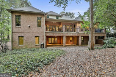 Don't miss this custom built all brick home with a 4 car garage on Whitewater Creek in Georgia - for sale on GolfHomes.com, golf home, golf lot