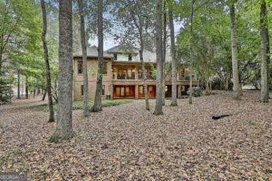 Don't miss this custom built all brick home with a 4 car garage on Whitewater Creek in Georgia - for sale on GolfHomes.com, golf home, golf lot