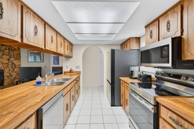 This beautifully maintained home has had all the big-ticket on Meadow Oaks Golf and Country Club in Florida - for sale on GolfHomes.com, golf home, golf lot