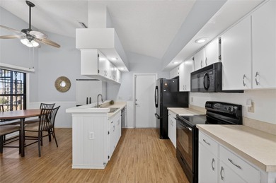 Step into this beautifully maintained 2-bedroom, 2-bath home on Sandpiper Golf Club in Florida - for sale on GolfHomes.com, golf home, golf lot