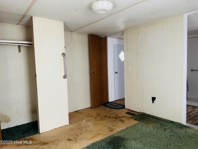 Affordable 3BDR/2BA single-wide manufactured home on one acre on Rivers Edge Golf Club in North Carolina - for sale on GolfHomes.com, golf home, golf lot