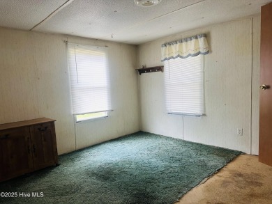 Affordable 3BDR/2BA single-wide manufactured home on one acre on Rivers Edge Golf Club in North Carolina - for sale on GolfHomes.com, golf home, golf lot