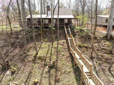 This comfortable cabin is located in a prime trout fishing area on  in Arkansas - for sale on GolfHomes.com, golf home, golf lot