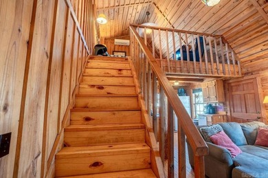 This comfortable cabin is located in a prime trout fishing area on  in Arkansas - for sale on GolfHomes.com, golf home, golf lot