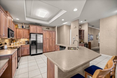 Welcome to this Entertainer's Dream Property overlooking the on Ocala Palms Golf and Country Club in Florida - for sale on GolfHomes.com, golf home, golf lot