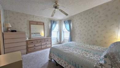 Welcome to your cozy retreat in the sought-after Golf Course on Blue Heron Pines Golf Course in Florida - for sale on GolfHomes.com, golf home, golf lot