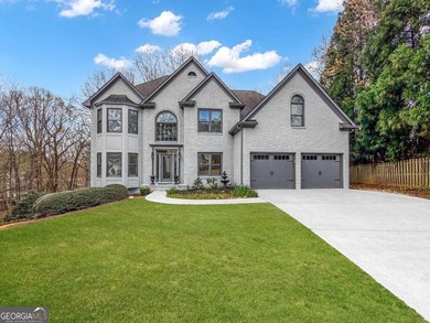 Welcome to this beautifully updated 5-bedroom, 3.5-bath home in on Towne Lake Hills Golf Club in Georgia - for sale on GolfHomes.com, golf home, golf lot